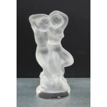A Lalique opaque glass figure of two nude females on an oval base, 14cm high