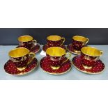 A Carlton ware polka dot patterned Art Deco coffee set of six cups and saucers with a red ground and
