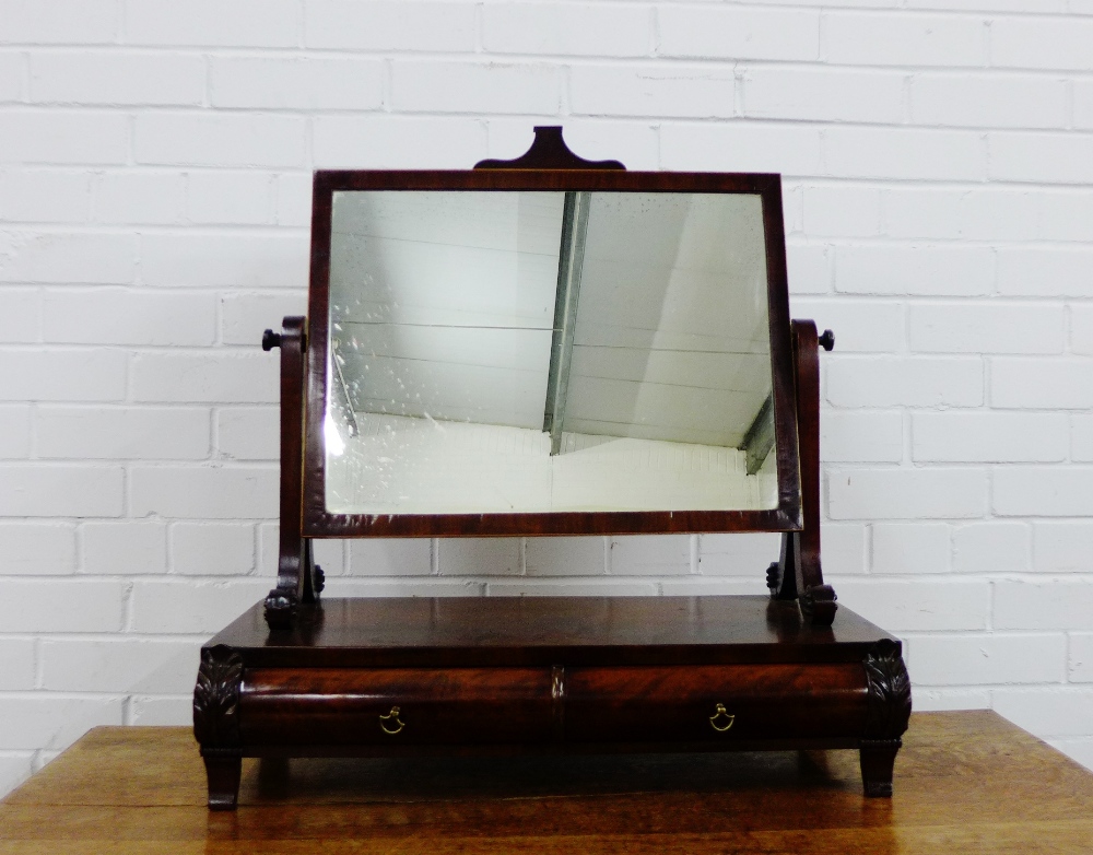 A mahogany dressing mirror, the rectangular plate over two cushion fronted drawers to the base, 70 x