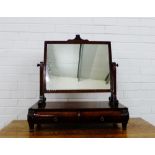 A mahogany dressing mirror, the rectangular plate over two cushion fronted drawers to the base, 70 x