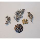 A tremble paste mounted floral spray brooch together with two marcasite brooches to include a