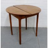 A 19th century fruit wood table, the circular top on tapering supports, 74 x 78cm