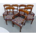 A set of six Victorian mahogany dining chairs, together with one carver, all with upholstered