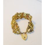 A 9 carat gold bracelet with heart padlock, approx 31 grams