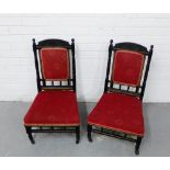 A pair of Aesthetic ebonised and parcel gilt side chairs with red upholstered backs and seats,