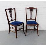 A pair of mahogany and inlaid side chairs, with vertical splat backs and pierced heart shaped motif,