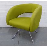 A retro chair with green upholstered curved top and seat, raised on quadruple chrome supports, 76