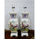 A pair of white glazed Chinoiserie ceramic table lamp bases, decorated with Peacock's, flowers and