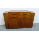 An Art Deco walnut sideboard of stylised form with four drawers and pair of burrwood cupboard doors,