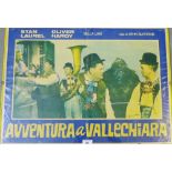 Laurel & Hardy framed coloured poster 'Avventura a Vallechiara' in a yellow clip art frame, 68 x