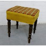 A Victorian stool with tapestry upholstered top and turned supports