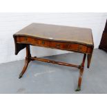 A mahogany sofa table, the rectangular top with reeded edge, over two frieze drawers, raised on