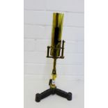 P. Paris Ltd, Dublin, brass table burner, adjustable, gas operated and on a triform cast iron