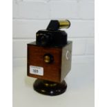 An Alex Wright & Co antique brass and wood flicker photometer, 19cm high