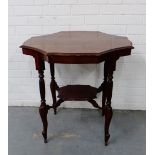 A mahogany octagonal occasional table, with undertier shelf and turned and fluted supports 70 x