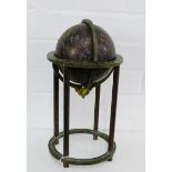 An Indo Persian bronze celestial globe on a gimbal and quadruple column support, approx 35cm high