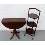 A mahogany circular drop leaf table together with a folding cake stand (2)