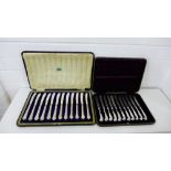 A set of twelve Sheffield silver handled butter knives, together with a cased set of eleven silver