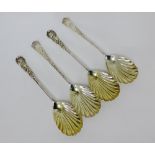 Four Victorian silver spoons, with shell bowls and foliate patterned stems and handles, with