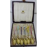 A set of six Swedish silver gilt and enamel harlequin coffee spoons in a cased box