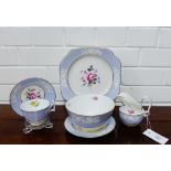 A Spode Copeland china tea set with floral moulded sprays against a lilac ground with further hand