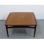 E Gomme for G-Plan teak coffee table, the square top with rounded edges and raised on turned