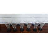 A set of six Art Deco drinking glasses with black foot rims, each engraved with an Acrobat or