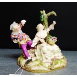 A 19th century Meissen group of Jester and a Lady (some small losses) and with blue cross swords