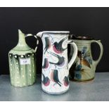 A group of three studio pottery glazed jugs to include Laurence McGowan pottery, and two others,