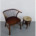An elm Windsor style chair with spindle back and brass stud work t the top rail, with solid seat and