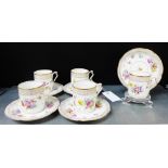 A set of six Dresden porcelain floral patterned and gilt edged cups and saucers, (6)