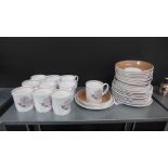 A Susie Cooper for Wedgwood floral patterned coffee set comprising eleven cups, twelve saucers and