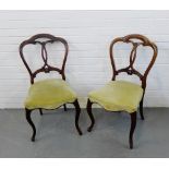 A pair of mahogany framed side chairs, with curved top rail and foliate carved interlaced splat