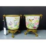 A pair of continental porcelain floral painted and butterfly patterned cache pots with gilt metal