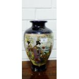 A Japanese earthenware baluster vase with figural panels against blue ground with gilt highlights,