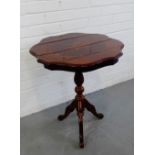 A mahogany occasional table on tripod supports