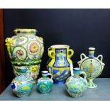 A collection of Italian and other Majolica wares, to include a floral moulded baluster vase with
