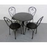 A black hardstone and metal four garden and table set (5)