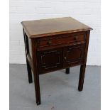 A mahogany cupboard, the rectangular top with moulded edge over a single drawer and pair of cupboard