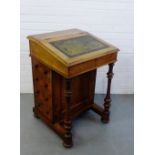 A 19th century mahogany Davenport, the sloped top with inset leather skiver over four drawers to the