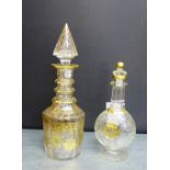 A 19th century gilt glass decanter and stopper painted with classical swags and stars with a facet