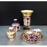 A collection of Royal Crown Derby Imari patterned porcelains to include an urn shaped vase, two