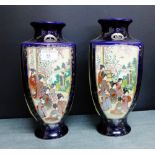 A pair of Japanese earthenware Satsuma style vases of square section baluster form painted with