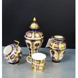 A collection of Royal Crown Derby Imari patterned porcelains to include pattern 1128 high shouldered