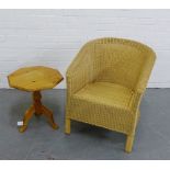 An octagonal pine occasional table and a basket weave tub chair (2)