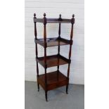 A mahogany four tier whatnot with a drawer to the base, all on turned balustrade supports, 135 x