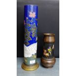 A Sarreguemines vase of cylindrical form with ducks, flowers and foliage against a blue ground on