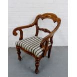 19th century mahogany open armchair, the curved top rail over a scrolling carved vertical splat,