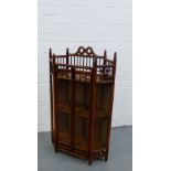 An American Arts & Crafts mahogany and glass cabinet, with a spindle galleried top and shelved