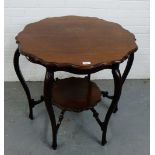 An Edwardian mahogany two tier occasional table with circular top and cabriole supports, 74 x 72cm